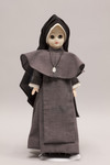 Doll wearing habit worn by Maryknoll Sisters of Saint Dominic