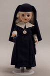Doll wearing habit worn by Our Lady of Victory Missionary Sisters