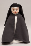 Doll wearing habit worn by Franciscan Missionaries of Mary