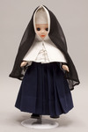 Doll wearing habit worn by Religious of the Sacred Heart of Mary