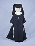 Doll wearing habit worn by Sisters of the Third Order of Saint Francis of Siessen Convent