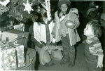 Child with Balloon near Christmas Tree