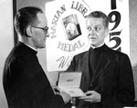 Fr. Monheim and Msgr. John S. Kennedy, Recipient of the Marian Library Medal, 1955