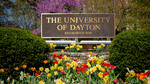 Background Image: University of Dayton Sign outside Campus South