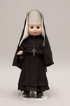 Doll wearing habit worn by Missionary Zelatrices of the Sacred Heart
