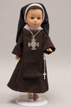 Doll wearing habit worn by Carmelite Sisters of the Third Order