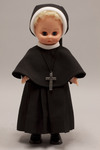 Doll wearing habit worn by Apostles of the Sacred Heart of Jesus