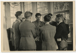Men standing in a circle at the Baltic University in Exile
