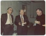 Two men conversing with a priest at 1963 Boston National Convention