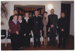 Caritas Program attendees with a priest