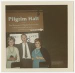 People under a Pilgrim Hall sign