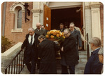 Pallbearers carrying a casket