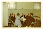 People seated at a table talking