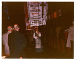 Woman holding a banner at the New England District Fall Convention, 1962