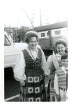 A woman and children smiling