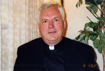 A priest posing
